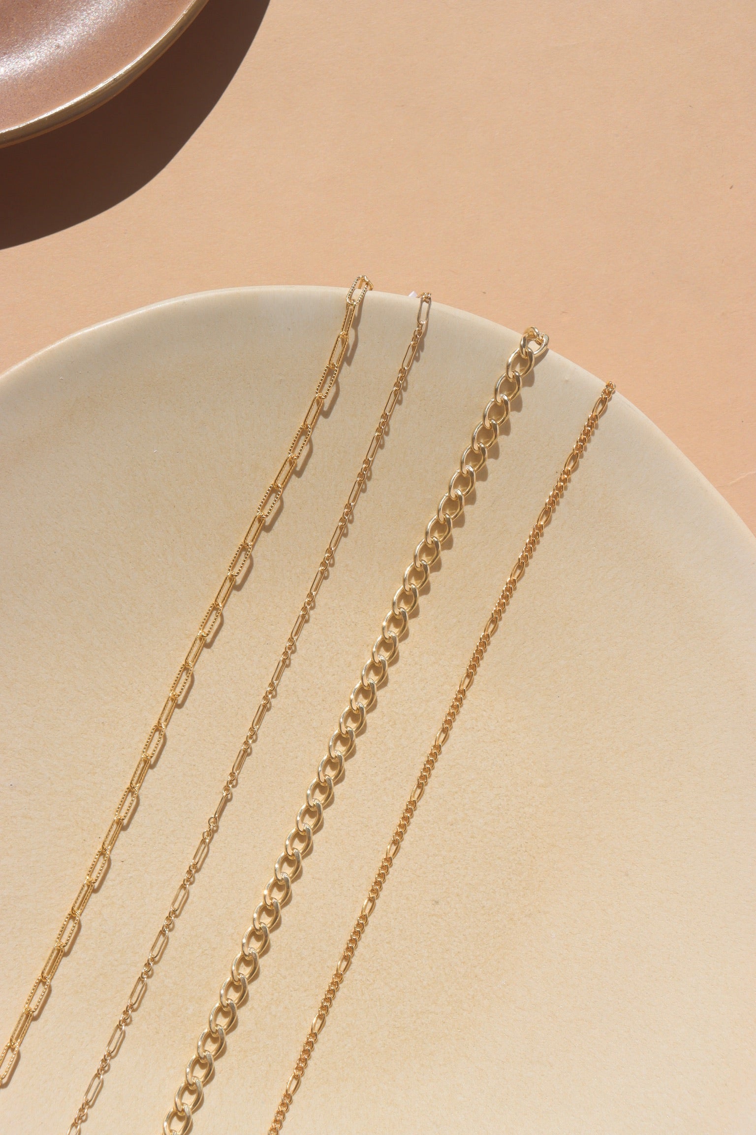 photo of four gold filled cable, curb and link chains