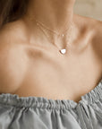 Model wearing Mini pearl Necklace.