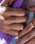 Model found wearing 14k gold fill sequin ring plus multiple other rings.