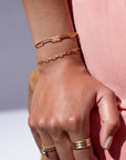 Model found wearing 14k gold fill Narrow Links Bracelet, also worn with the chain link bracelet