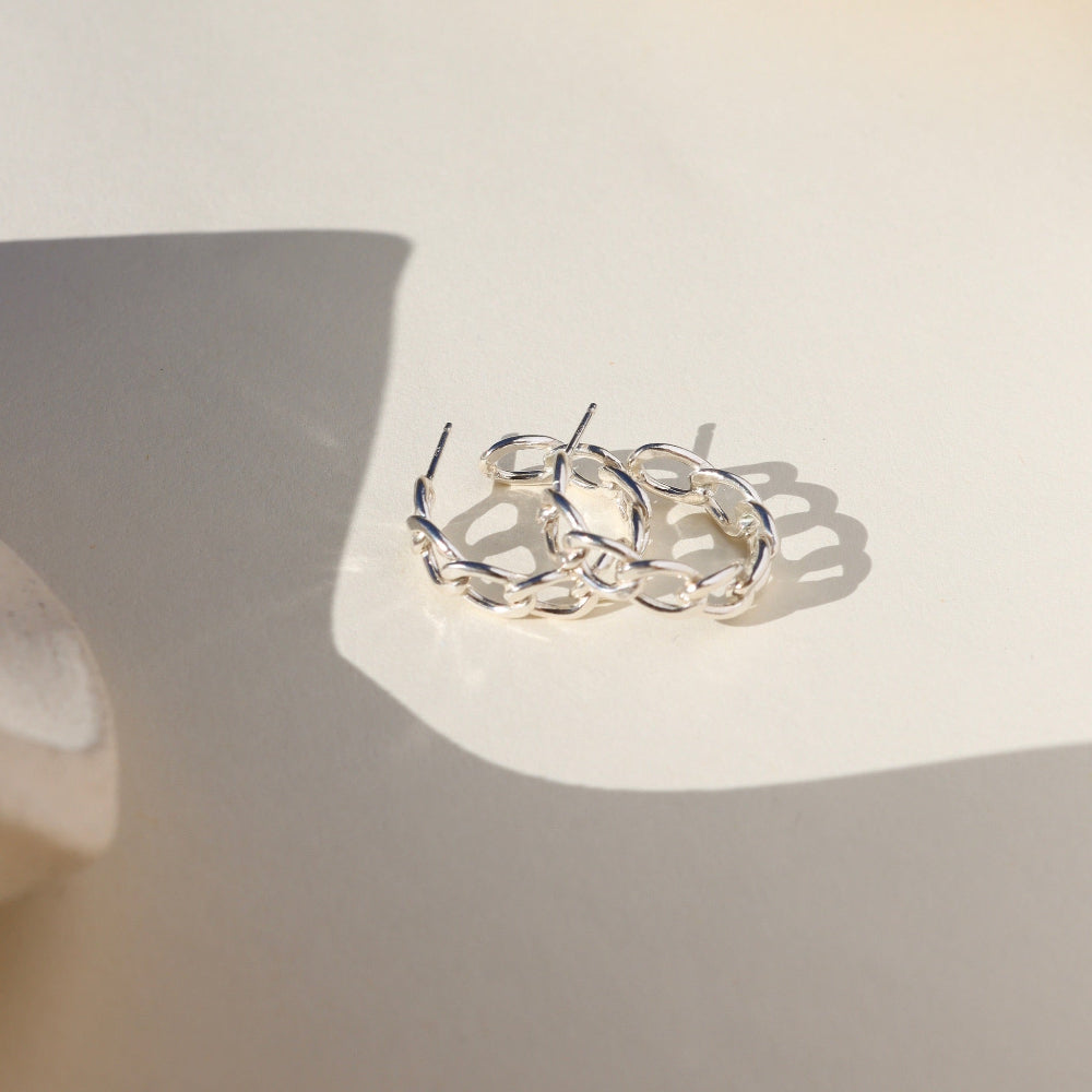 Alex Hoops — sculptural 14K gold fill or sterling silver hoops, lightweight and modern, perfect for layering or wearing solo.