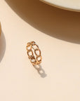 Alex Ring in gold fill and sterling silver, structural curb chain design, shown stacked with other rings and worn solo