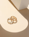 Alex Ring in gold fill and sterling silver, structural curb chain design, shown stacked with other rings and worn solo