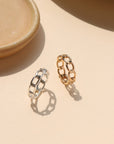 Alex Ring in gold fill and sterling silver, structural curb chain design, shown stacked with other rings and worn solo