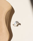 Curved hammered stacking ring in sterling silver with a rainbow-like arc shape