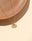 14k gold fill dainty chain necklace with 2 14k gold fill small disk charms that have flowers hand stamped