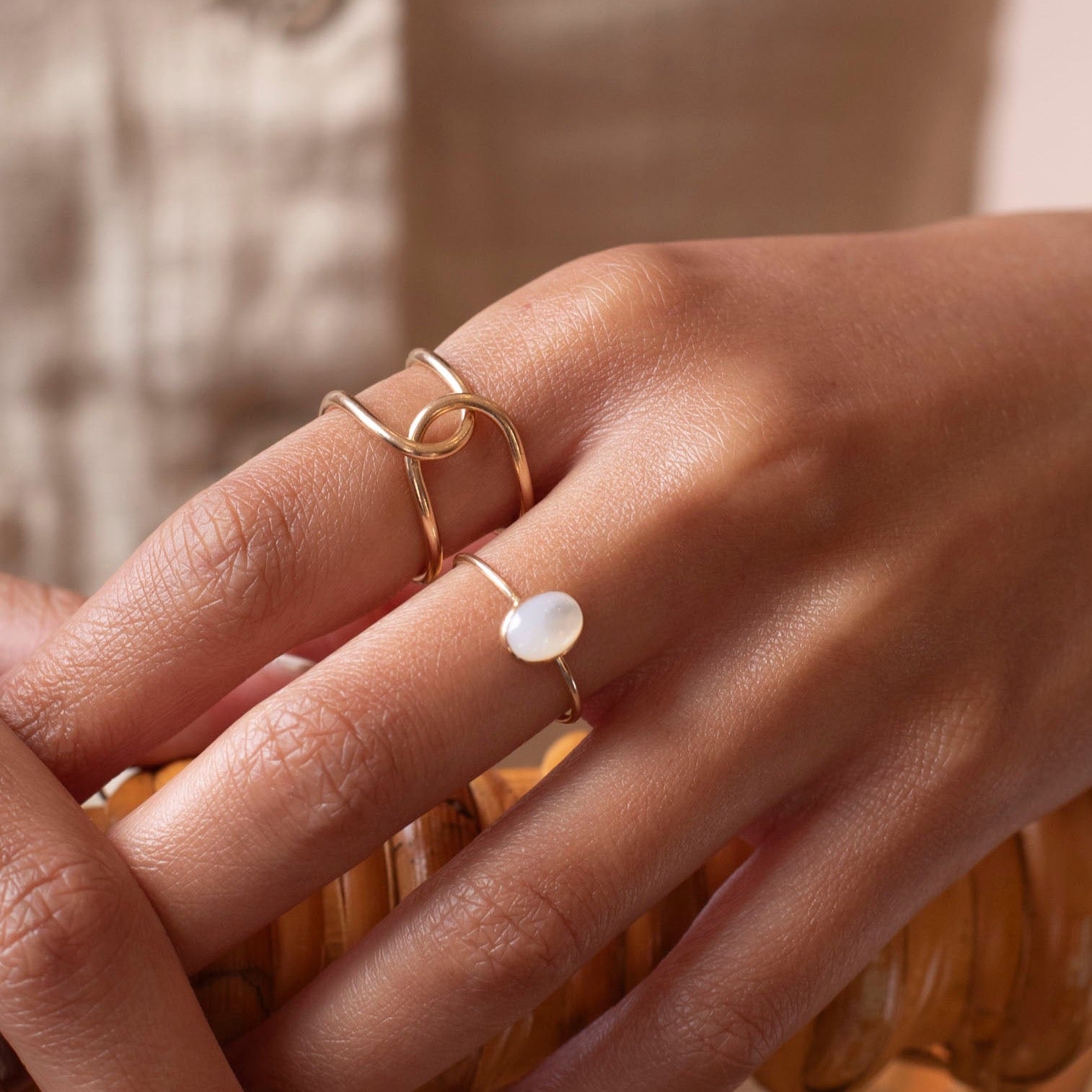 Buckle Ring worn with the essential opal ring