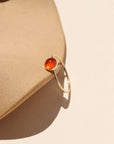 Close-up of fiery carnelian glow ring in gold fill setting