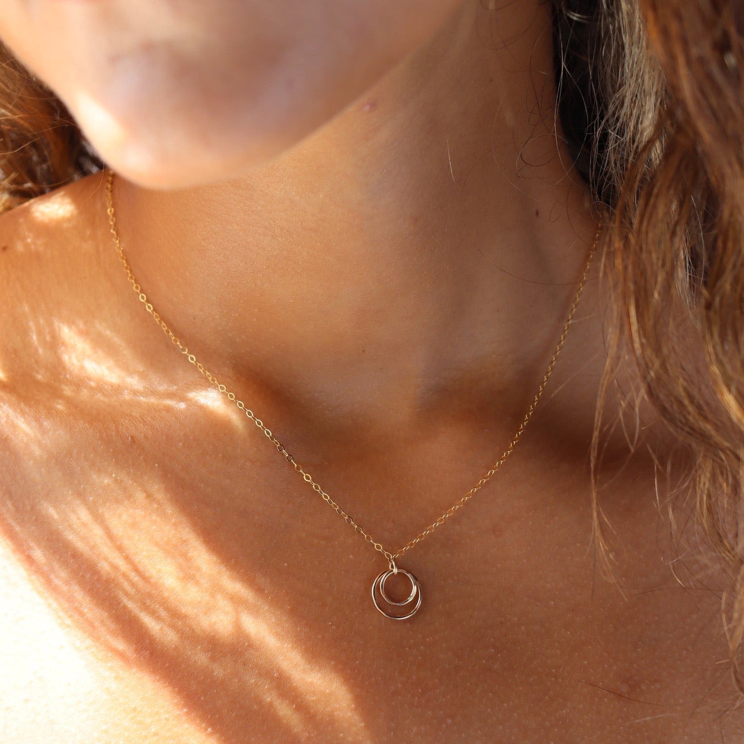 Model wearing 14k gold fill Eclipse Necklace