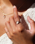 model wearing 14k gold fill esme ring in sunlight