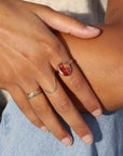 The Harvest Ring features a mookite gemstone encased in a pretty oval bezel, set within your choice of a textured 14k gold fill or sterling silver band.