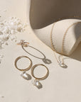 Handcrafted gold hoops adorned with faceted crystals for a subtle shimmer and timeless look.