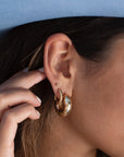 Model wearing 14k gold fill Cloud Hoops