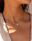 Model wearing 14k gold fill Modern Muse initial necklace.This Necklace feature our Demi Alexandra chain featuring a charm initial of your choice.