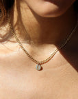 Model wearing 14k gold fill Modern Muse initial necklace.This Necklace feature our Demi Alexandra chain featuring a charm initial of your choice.