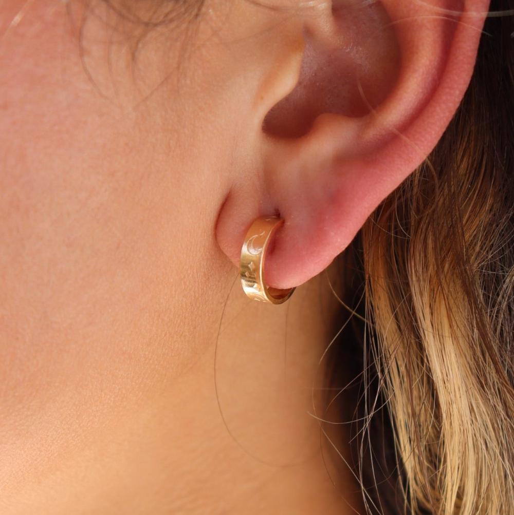 Model wearing Starry Night Huggies in 14k gold fill