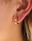 Model wearing Starry Night Huggies in 14k gold fill