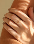 Model wearing two 14k gold fill circle
