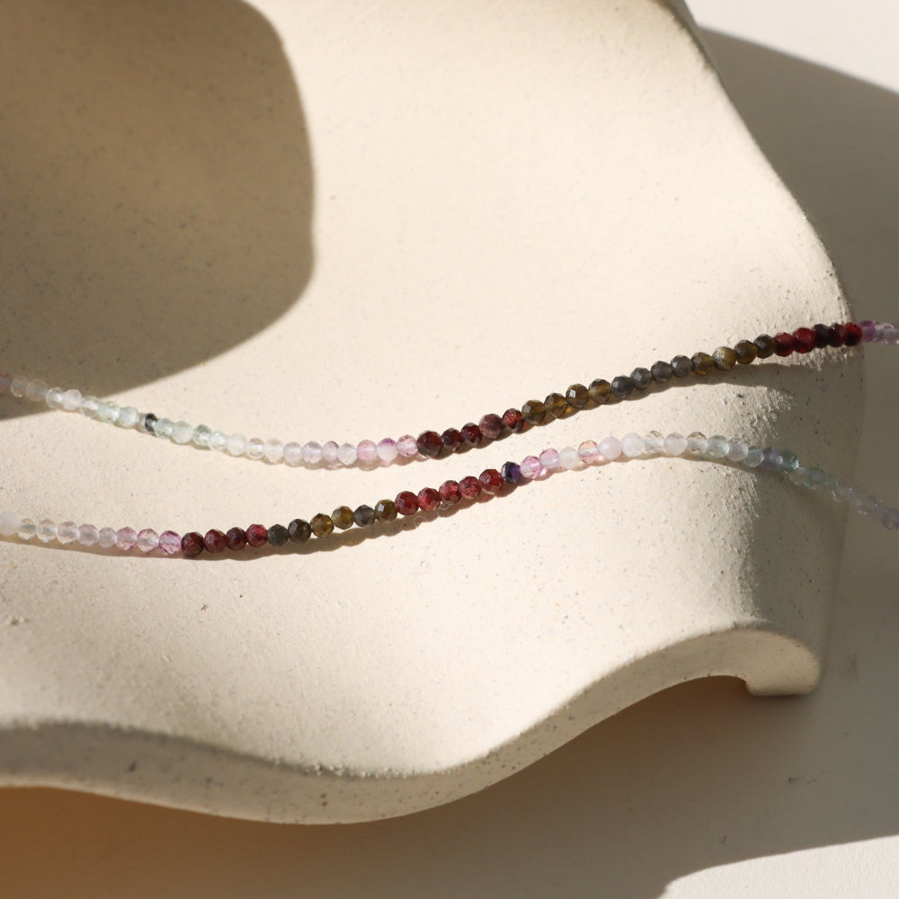 Moonwake Necklace featuring fluorite, golden obsidian, and garnet beads in rich twilight tones