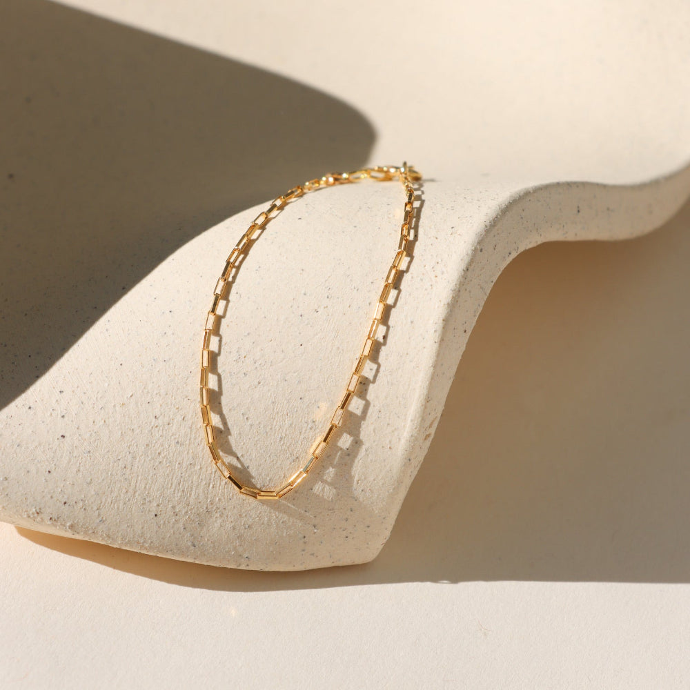 Nova Chain Bracelet in 14k gold fill or sterling silver, featuring a sleek box chain that reflects light with every movement