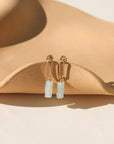 Selene Drops featuring pale green-blue chalcedony beads suspended from a slender oval in gold fill