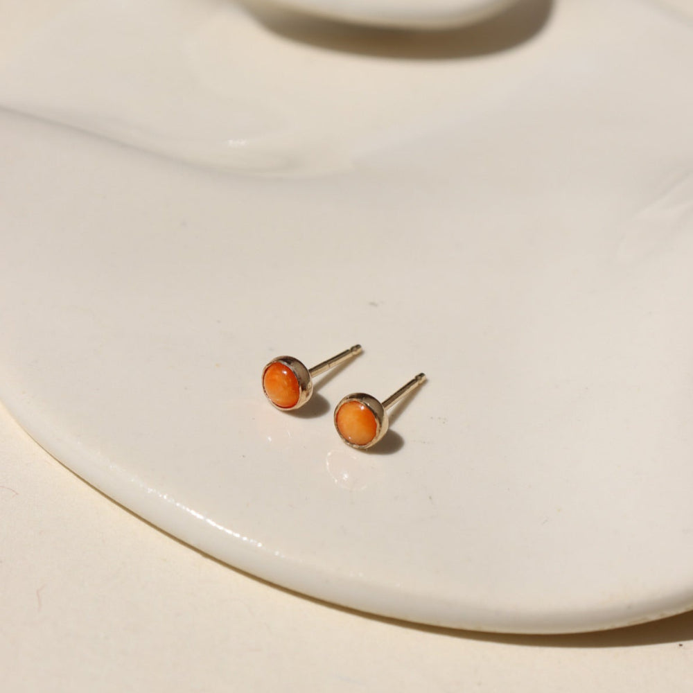 Sienna Studs featuring 4mm fiery orange spiny oyster cabochons in sterling silver bezel settings.
