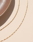 14k gold fill lip chain sparkling in natural sunlight