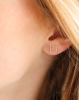 Minimal 14k gold or sterling silver bar studs. Choose from small or large sizes. Available at Token Jewelry in Eau Claire, WI  