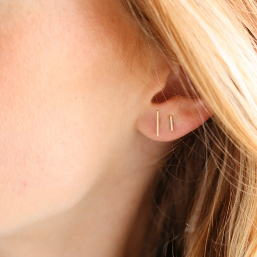 Minimal 14k gold or sterling silver bar studs. Choose from small or large sizes. Available at Token Jewelry in Eau Claire, WI  