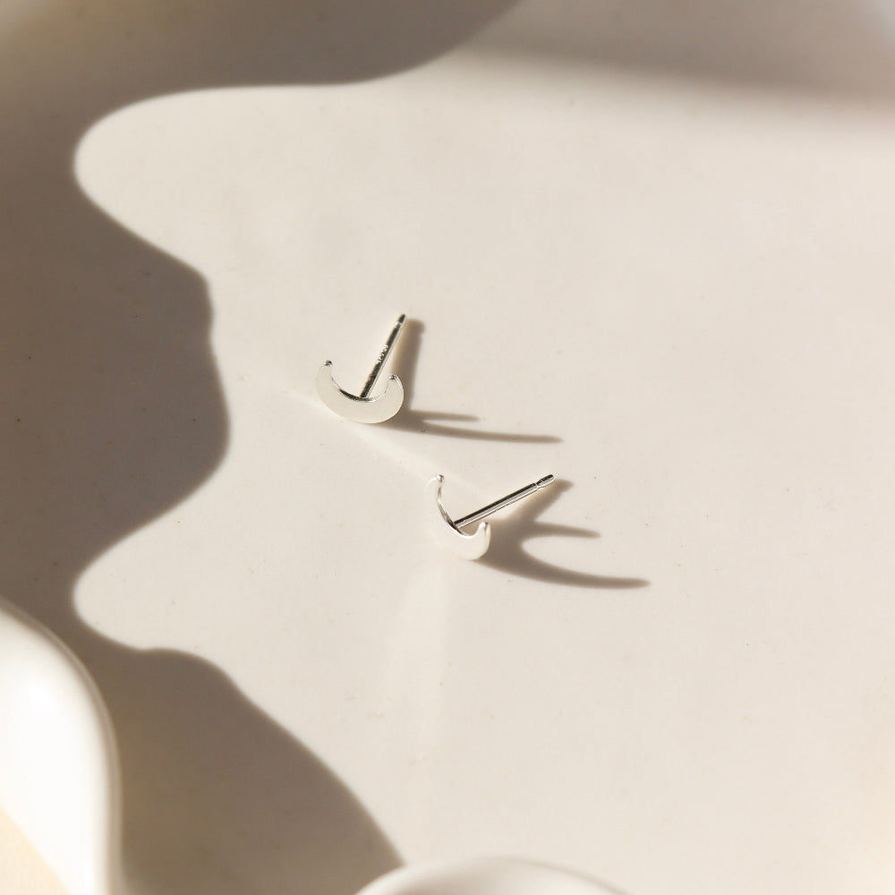 Tiny Moon Studs in sterling silver by Token Jewelry