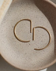 Half circle threader earring made from 14k gold fill or sterling silver. Handmade by Token Jewelry in Eau Claire, WI