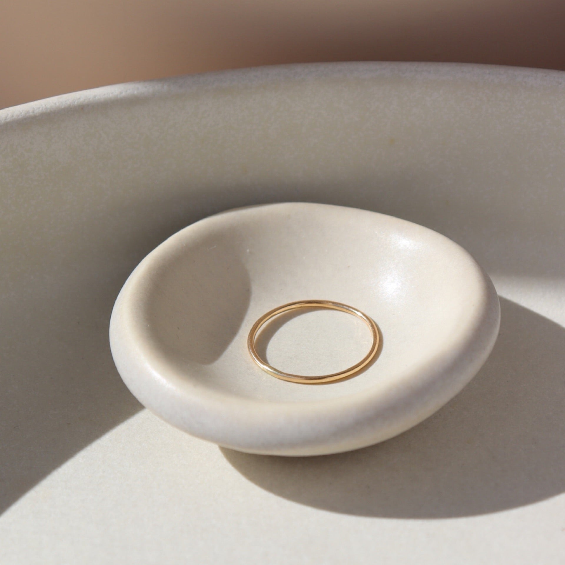 14k gold fill Minimal ring on a white plate