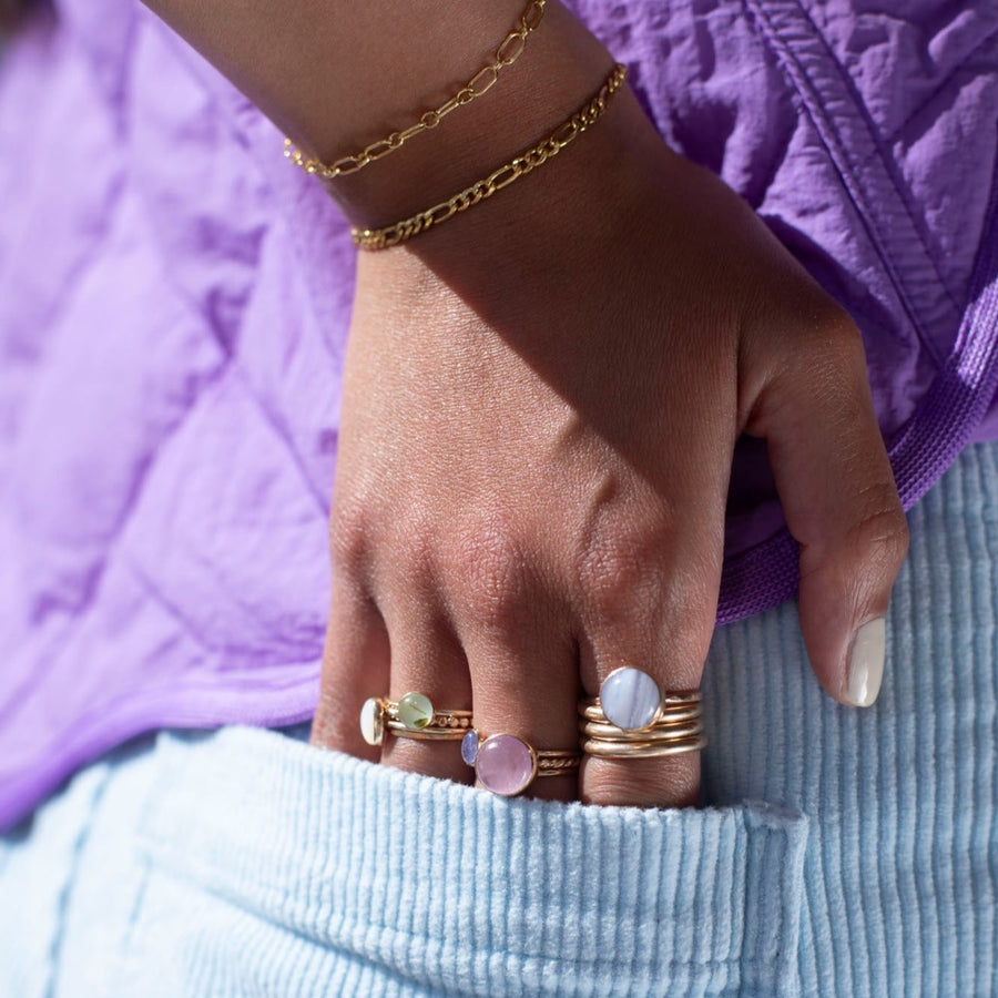 Model Wearing 14k gold fill Blue Lace Agate Ring. This Ring Features a simple band with light hammering around the sides, this ring also features the Blue Lace Agate Ring.