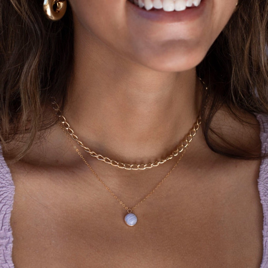 Model wearing 14k gold fill Blue Lace Agate Necklace. This Necklace features our simple chain along with a Blue Lace Agate gemstone.