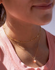 Model found wearing g14k gold fill Cherry Blossom Necklace.
