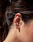 Model found wearing 14k gold fill daisy stud paired with a ear cuff as well as the simple chain link studs.