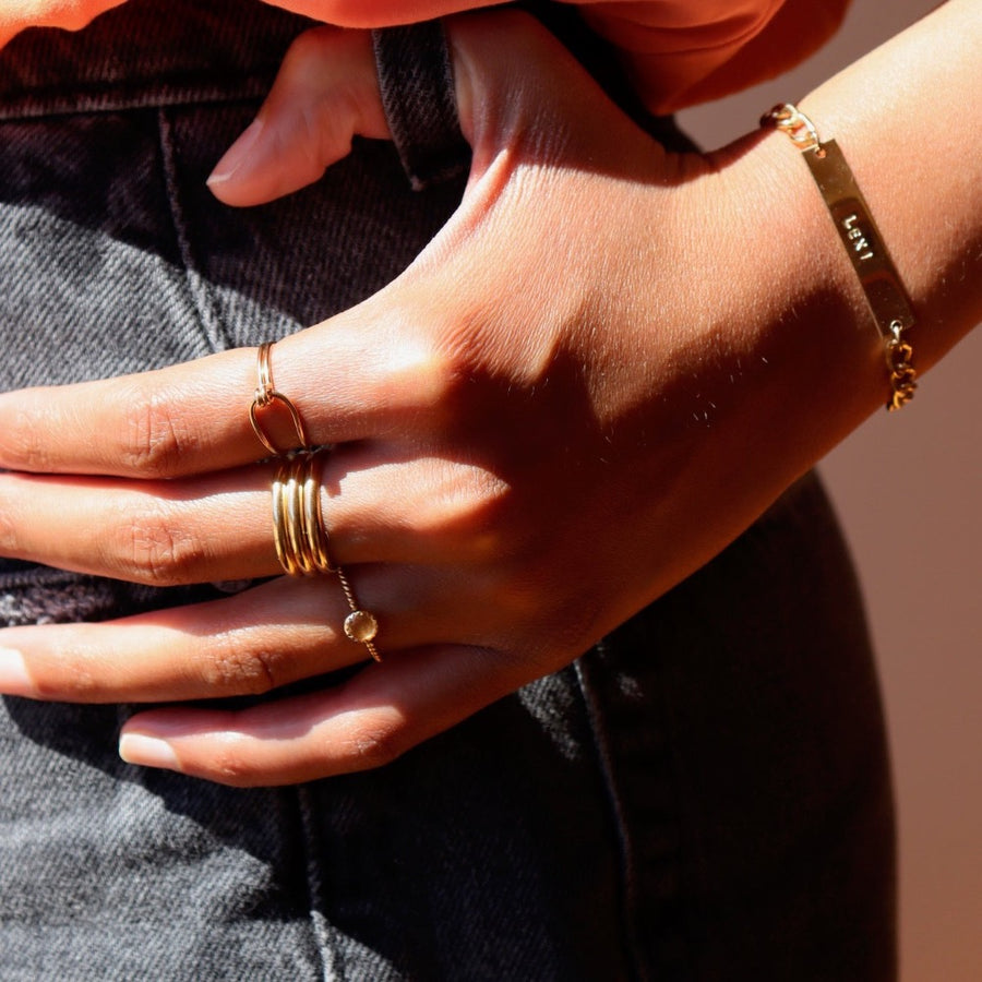 Model Wearing 14k gold fill Gaia Ring. This ring features a Spiral band with a zircon gemstone.
