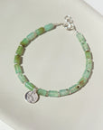 Chrysoprase Beads and Spacer Beads with a 925 sterling silver coin bracelet, handmade by Token Jewelry