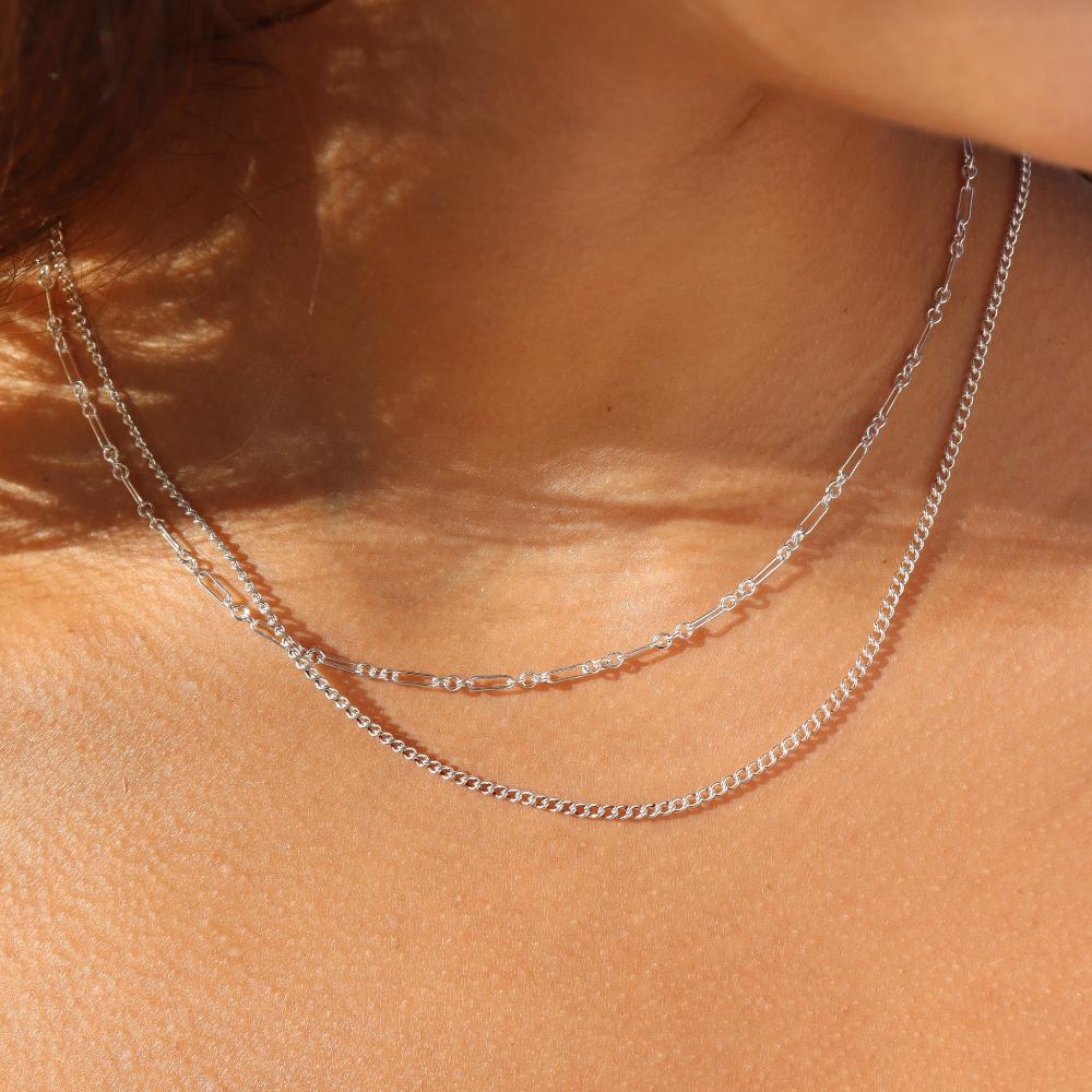 925 sterling silver Callie chain on model paired with the silver la mer chain