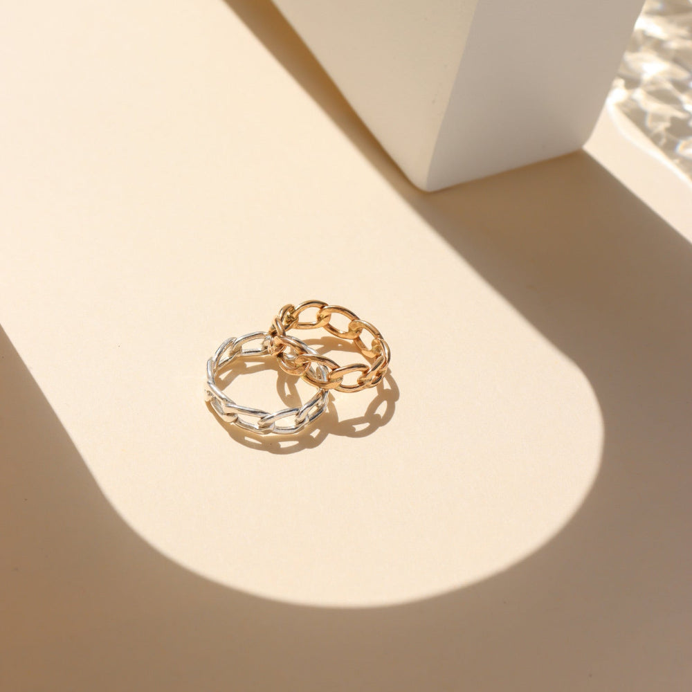 Alex Ring in gold fill and sterling silver, structural curb chain design, shown stacked with other rings and worn solo