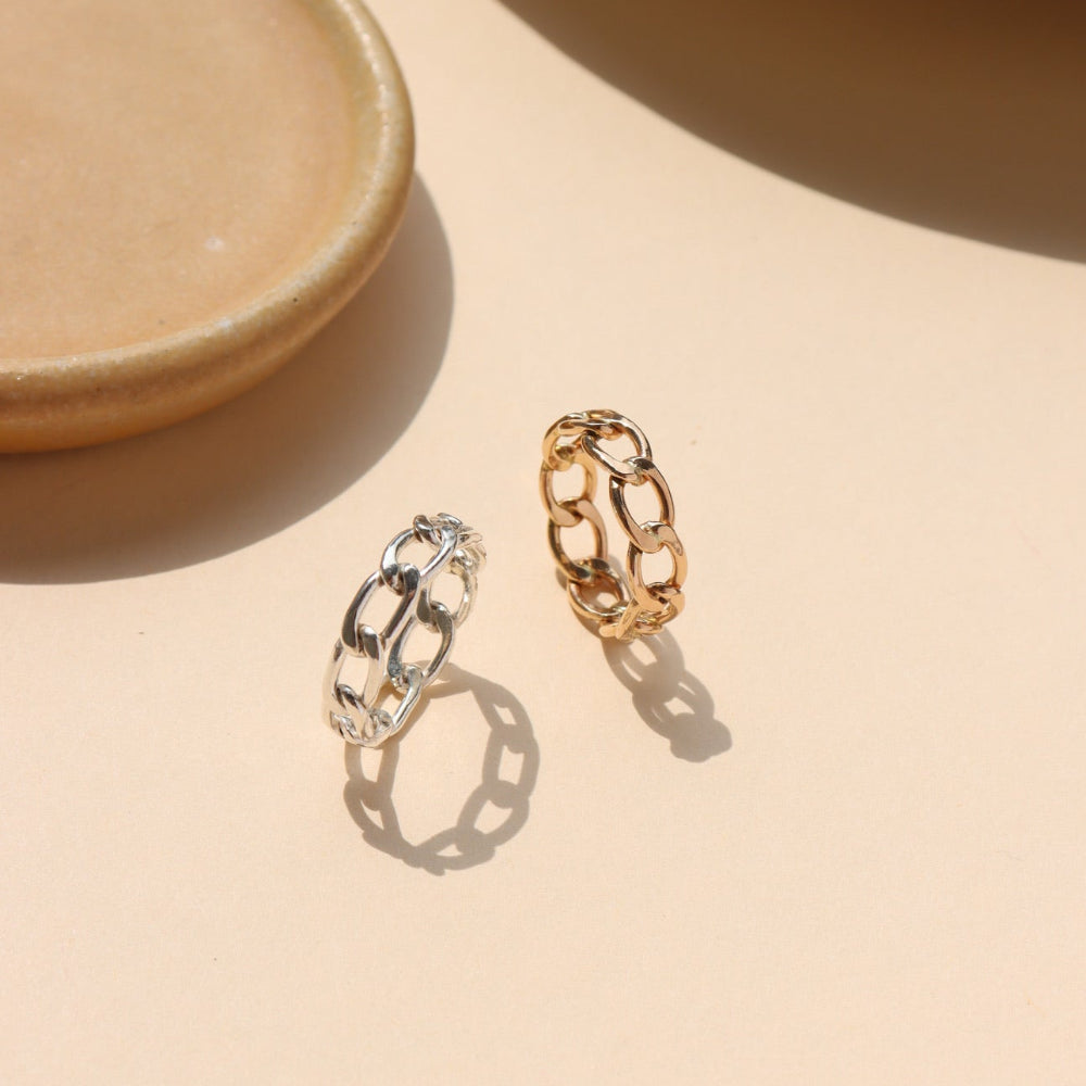 Alex Ring in gold fill and sterling silver, structural curb chain design, shown stacked with other rings and worn solo