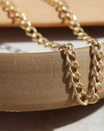 Bold and chunky 14k gold filled curb chain with a lobster clasp and 2" extender chain to make the necklace adjustable from 14" to 16". Alexandra Choker, handmade by Token Jewelry in Eau Claire, WI  jewelry store near me, permanent jewelry, jewelry repair near me, rings, earrings, necklace, bracelet, gold chain, gemstones, rose gold