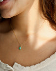 Model wearing a 6x8mm Amazonite Gemstone set in a 14k gold fill bezel. The necklace features a thin standard chin.