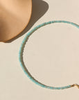 A fully beaded Amazonite necklace with a 14k gold fill standard clasp. The necklace is displayed on a cream back drop. 