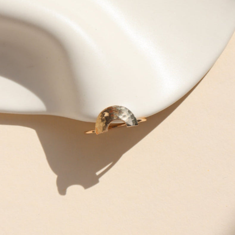 Curved hammered stacking ring in gold fill with a rainbow-like arc shape