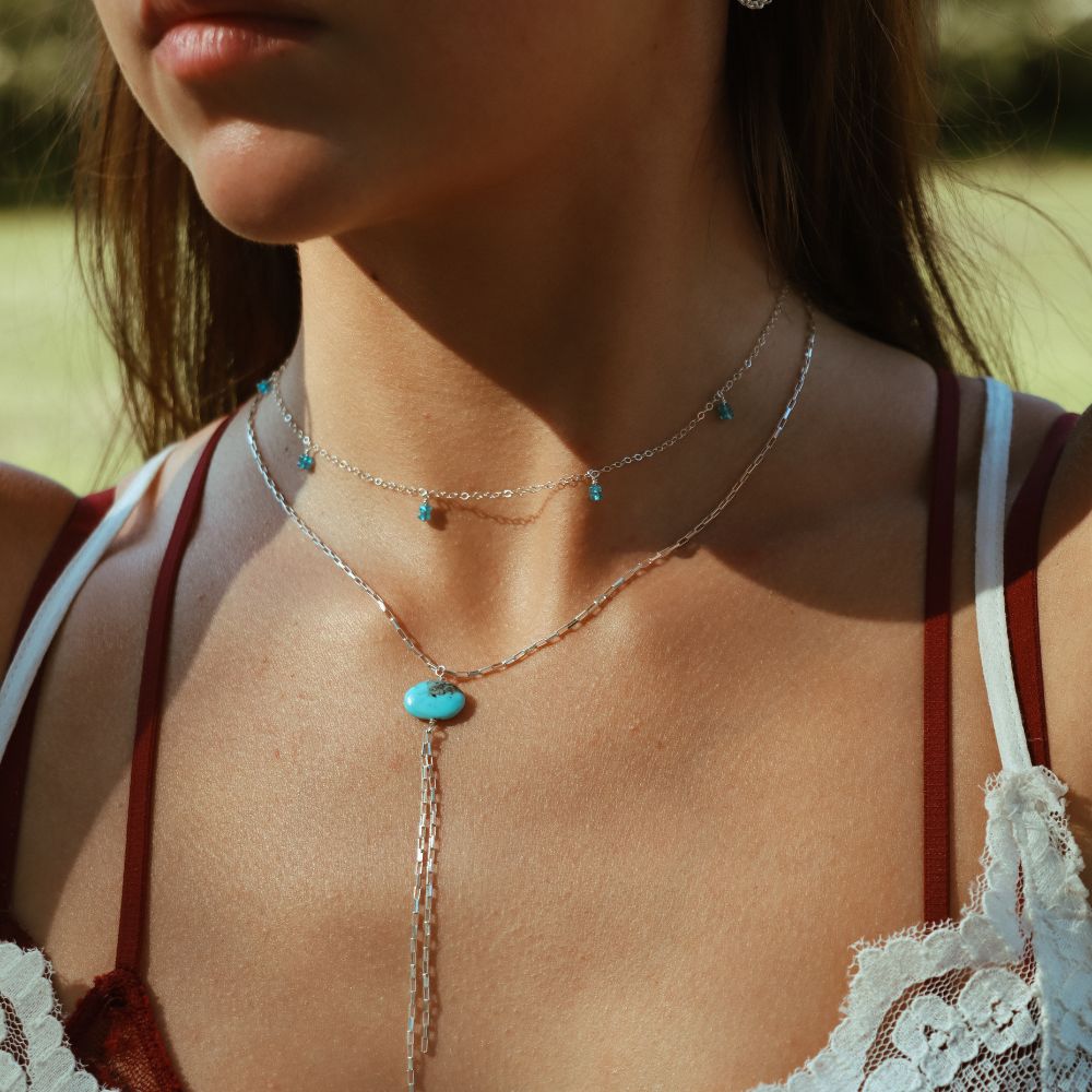 model wearing sterling silver jewelry with gemstones