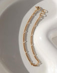 14k gold fill Capri Bracelet on white plate