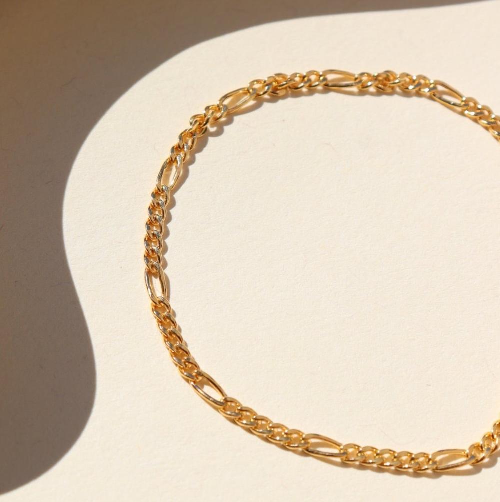 Capri Bracelet in 14k gold fill on a white paper