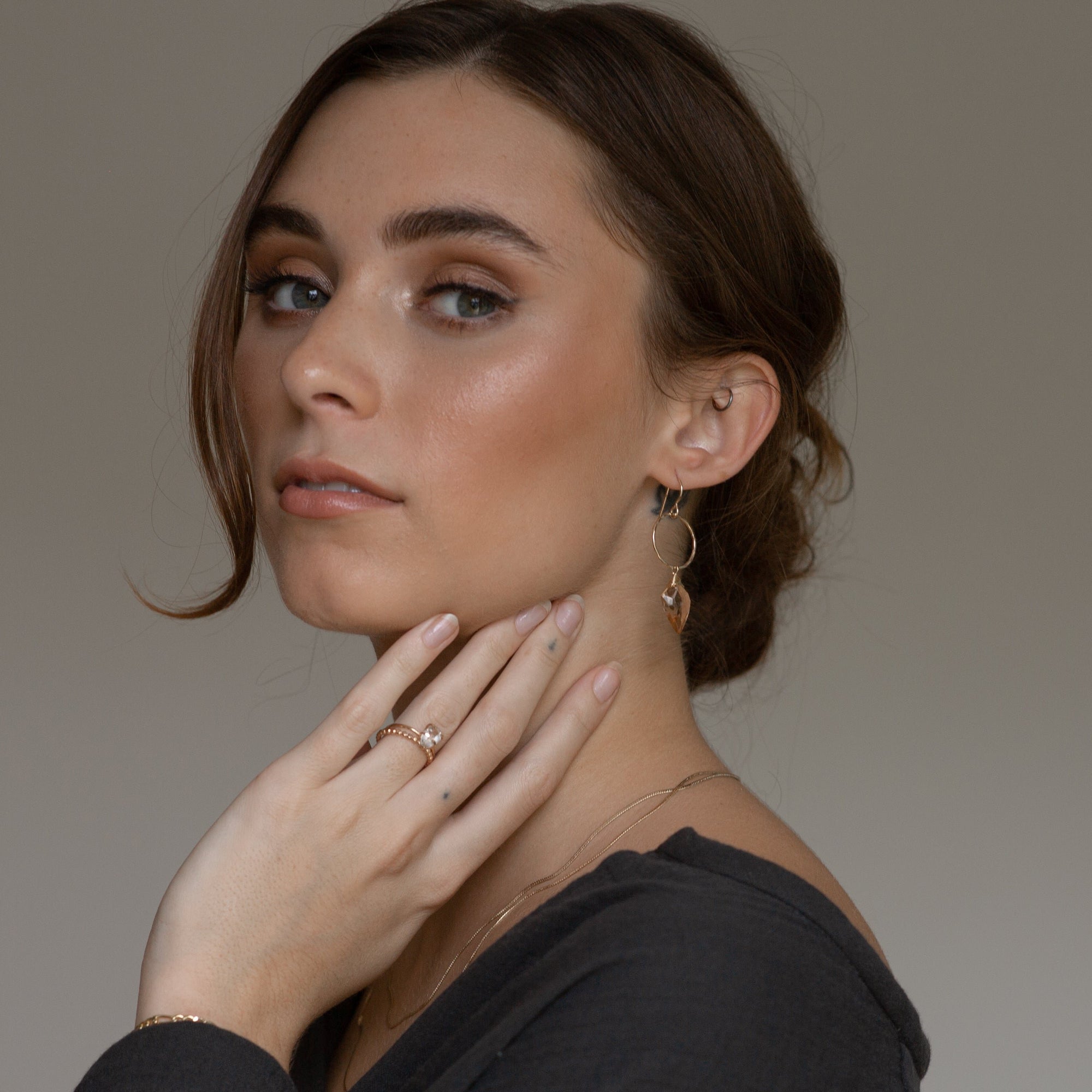 model wearing 14k gold fill earrings with rose quartz charms