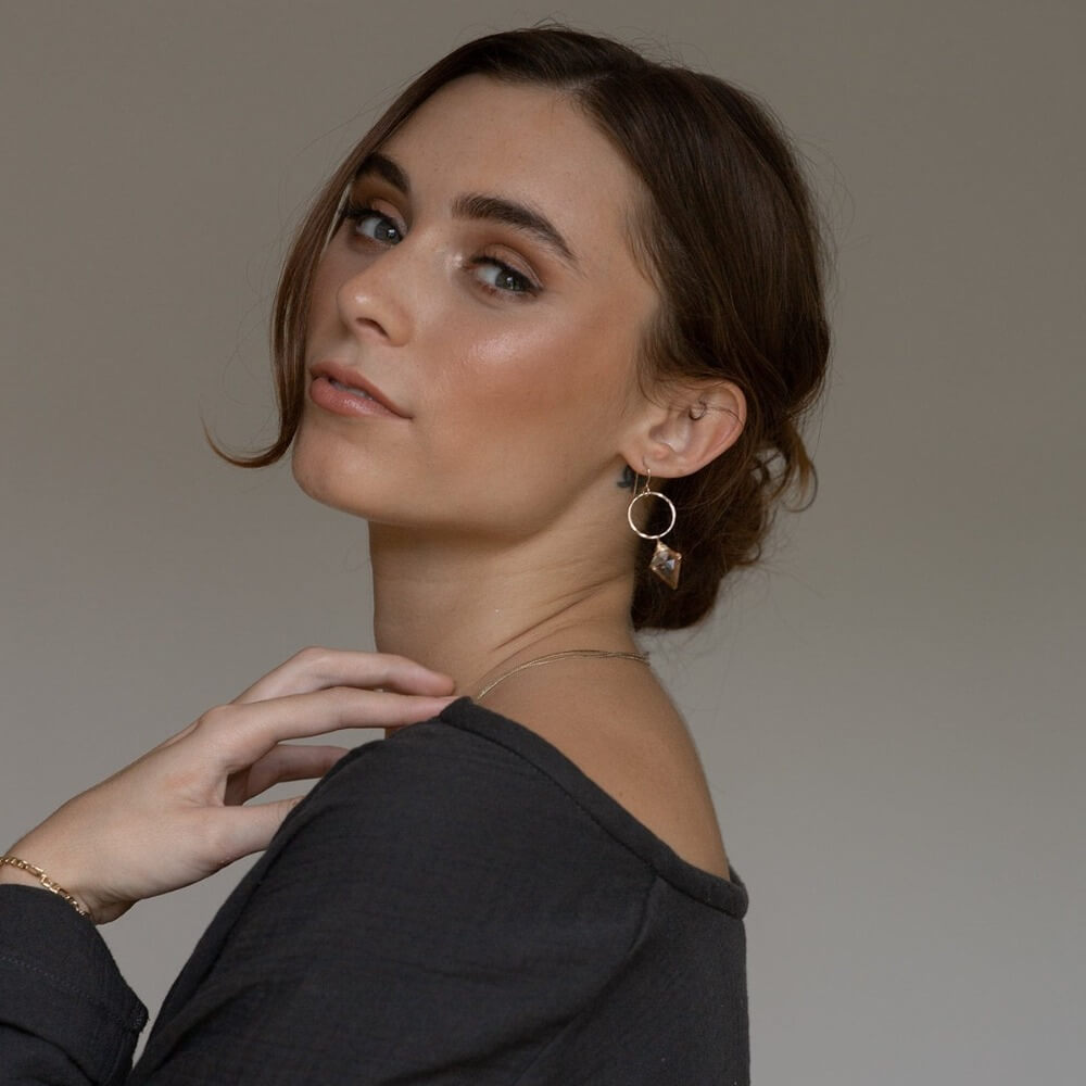 model wearing 14k gold fill earrings with rose quartz charms